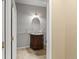 Charming half-bath with an ornate vanity and decorative accents at 619 S Norfolk Way, Aurora, CO 80017