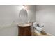 Classic half-bath features a pedestal sink and a tiled backsplash at 619 S Norfolk Way, Aurora, CO 80017