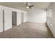 Bright bedroom featuring large windows and a ceiling fan at 619 S Norfolk Way, Aurora, CO 80017