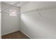 Carpeted walk-in closet featuring wire shelving at 619 S Norfolk Way, Aurora, CO 80017
