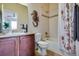 Cozy bathroom featuring vanity with storage, a bathtub, and a shower at 16022 W 63Rd Ln # A, Arvada, CO 80403