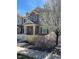 Charming townhome with a mix of brick and siding, complemented by a manicured front yard and a white picket fence at 16022 W 63Rd Ln # A, Arvada, CO 80403