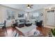 Bright living room features hardwood floors and neutral furniture at 16022 W 63Rd Ln # A, Arvada, CO 80403