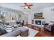 Bright living room showcases hardwood floors, a cozy fireplace, and neutral tones at 16022 W 63Rd Ln # A, Arvada, CO 80403