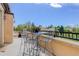 Spacious balcony with table, chairs, and decorative plant life overlooks scenic city views at 2500 E Cherry Creek South Dr # 306, Denver, CO 80209
