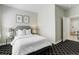 Inviting bedroom featuring neutral tones, a plush bed, and contemporary décor at 2500 E Cherry Creek South Dr # 306, Denver, CO 80209