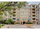 Well-maintained building exterior, featuring balconies, fountain and manicured landscaping at 2500 E Cherry Creek South Dr # 306, Denver, CO 80209