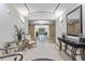 View of the luxurious lobby featuring decoratively framed mirror, light fixtures, and tiled floor at 2500 E Cherry Creek South Dr # 306, Denver, CO 80209