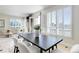 Bright dining area with shuttered windows, fireplace, and access to the balcony at 2500 E Cherry Creek South Dr # 306, Denver, CO 80209