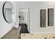 Inviting hallway with stylish décor, leading to a brightly lit bedroom at 2500 E Cherry Creek South Dr # 306, Denver, CO 80209