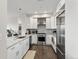 Modern kitchen featuring stainless steel appliances, granite countertops, and ample cabinet space at 2500 E Cherry Creek South Dr # 306, Denver, CO 80209