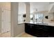 Open-concept kitchen with breakfast bar, modern appliances and seamless flow to the living area at 2500 E Cherry Creek South Dr # 306, Denver, CO 80209