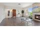 View of living room featuring hardwood floors, stone fireplace, and large window at 2500 E Cherry Creek South Dr # 306, Denver, CO 80209