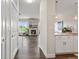 View of the living room with stone fireplace and view into the kitchen at 2500 E Cherry Creek South Dr # 306, Denver, CO 80209