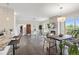 Open-concept living area with modern furnishings, fireplace, dining area, and natural light at 2500 E Cherry Creek South Dr # 306, Denver, CO 80209