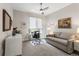 Cozy home office with a comfortable sofa, desk, and natural light at 2500 E Cherry Creek South Dr # 306, Denver, CO 80209