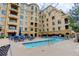 Beautiful condo building offers a stunning pool area with ample seating and open sky at 2500 E Cherry Creek South Dr # 306, Denver, CO 80209