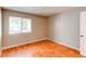 Neutral bedroom with window and hardwood flooring at 2479 S Xanadu Way # C, Aurora, CO 80014