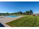 Inviting community pool surrounded by lounge chairs and well-maintained landscaping at 2479 S Xanadu Way # C, Aurora, CO 80014
