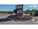 Heather Ridge Golf Club sign featuring stone detail and manicured rock landscaping at 2479 S Xanadu Way # C, Aurora, CO 80014