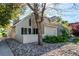 Charming home exterior featuring a covered front porch and well-maintained landscaping at 2479 S Xanadu Way # C, Aurora, CO 80014