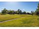 Lush green space with mature trees and pathways, perfect for a leisurely stroll at 2479 S Xanadu Way # C, Aurora, CO 80014