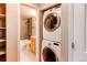 Laundry area near bathroom with stacked washer and dryer at 2479 S Xanadu Way # C, Aurora, CO 80014