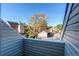 Balcony view of neighborhood with mature tree and parking area at 2479 S Xanadu Way # C, Aurora, CO 80014