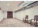 Spacious finished basement with a cozy brick fireplace and neutral carpet, perfect for entertaining at 1720 Chaparro Cir, Berthoud, CO 80513