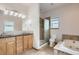 Bathroom with double sinks, shower, toilet, and soaking tub at 1720 Chaparro Cir, Berthoud, CO 80513