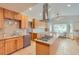Bright kitchen with granite countertops, center island, stainless appliances, and eat-in dining area at 1720 Chaparro Cir, Berthoud, CO 80513