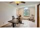 Office space featuring hard floors, bright windows, desk, and a ceiling fan perfect for working from home at 1720 Chaparro Cir, Berthoud, CO 80513