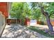 Landscaped backyard featuring a spacious wood deck, mature trees, privacy fence and detached garage at 760 S 42Nd St, Boulder, CO 80305