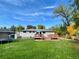 Spacious backyard with deck, trampoline, and mature trees at 1035 W Longview Ave, Littleton, CO 80120