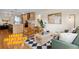 Bright living room with hardwood floors, modern furniture, and an open floor plan at 2812 N Harrison St, Denver, CO 80205