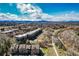 A stunning aerial view of a multi-Gathering complex near a river and the mountains at 6000 W Floyd Ave # 307, Denver, CO 80227