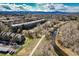 Scenic aerial view of condo neighborhood, with a river, trail and mountain views at 6000 W Floyd Ave # 307, Denver, CO 80227