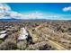 Panoramic aerial view of neighborhood with mountain backdrop, trail system and mature trees at 6000 W Floyd Ave # 307, Denver, CO 80227