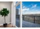Balcony doorway with a plant and view of the landscape at 6000 W Floyd Ave # 307, Denver, CO 80227