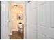 Bathroom featuring tile floors and a view of the toilet and sink at 6000 W Floyd Ave # 307, Denver, CO 80227