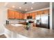 Well-lit kitchen with stainless steel refrigerator, appliances, and ample counter space at 6000 W Floyd Ave # 307, Denver, CO 80227