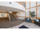 Grand lobby with staircase, high ceilings and natural light, offering a welcoming atmosphere at 6000 W Floyd Ave # 307, Denver, CO 80227