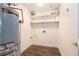 Storage room with essential utilities, shelving and laminate floor, offering practical space at 6000 W Floyd Ave # 307, Denver, CO 80227