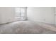 Spacious bedroom with neutral carpet, window with blinds and white walls at 4592 Malaya St, Denver, CO 80249