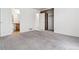 Carpeted bedroom with closet space and an ensuite bathroom at 4592 Malaya St, Denver, CO 80249