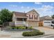 Charming two-story home with neutral siding, red shutters, and a well-manicured front yard at 4592 Malaya St, Denver, CO 80249