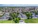 Aerial view of a residential community with mature trees and well-maintained landscaping at 1216 S Uvalda St, Aurora, CO 80012