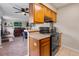 Open kitchen view featuring wooden cabinets and modern appliances that flow into a spacious living area at 1216 S Uvalda St, Aurora, CO 80012