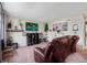 Well-lit living room featuring comfortable seating, modern decor, and a serene ambiance at 1216 S Uvalda St, Aurora, CO 80012