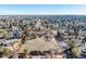 Aerial image of a property with mature trees, nearby homes, and street access, defined by red lines at 4747 E Mansfield Ave, Englewood, CO 80113